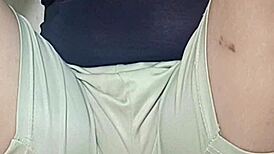 Naked housewife plays video game with huge exposed pussy on display