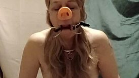 slave's self session indoctrination with pig snout blowjob and spreader