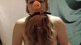 slave's self session indoctrination with pig snout blowjob and spreader