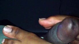 ebony babe strokes black cock with her sexy feet