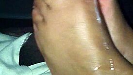 ebony babe strokes black cock with her sexy feet