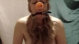 slave's self session indoctrination with pig snout blowjob and spreader