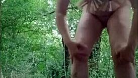 Slave humiliated in forest, bent over doggystyle with dildo while chained and slapped??