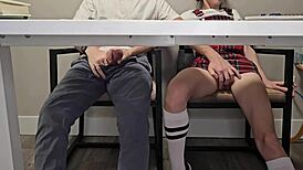 Skinny college girl in uniform flashes wet pussy under desk during dull lecture