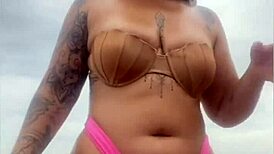 guy flashes swollen pussy from bermuda shorts on beach