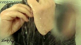 Latex femdom teases ass in shower nylons!