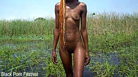 Can you handle watching this slim African beauty's soft narrow ass glisten while she baths naked in the river outdoors?
