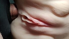 She rides double penetration toys close-up her shaved big pussy stretched wide like a fuck doll