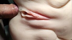 She rides double penetration toys close-up her shaved big pussy stretched wide like a fuck doll