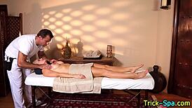 Blonde babe strokes masseur's dick with tattooed hands