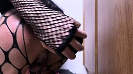 Shemale Stuffs Huge Dildo in Fishnet Cage Ass