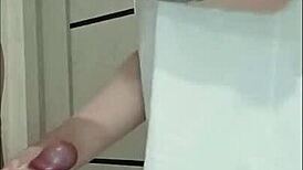 Stepmom's friend grips and strokes cock at house party