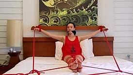 sofi tied tight in red ropes on bed squirms part 2