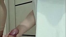 Stepmom's friend grips and strokes cock at house party