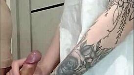 Stepmom's friend grips and strokes cock at house party