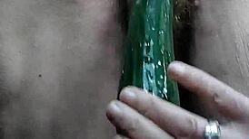 Granny Teases Hairy Spot with Cucumber Play