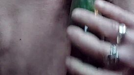 Granny Teases Hairy Spot with Cucumber Play