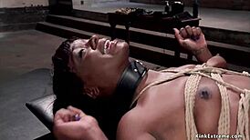 Bound ebony trainee chokes on gimp slave's rough deepthroat in kinky bdony whipping session