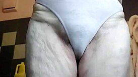 Granny Teases Hairy Spot with Cucumber Play