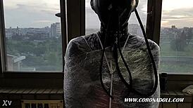 asian in latex catsuit endures outdoor public rubber bondage mummification