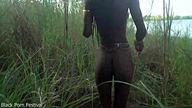 Skinny African village girl struts naked outdoors hunting for cock