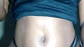 Beautiful black lady massages her huge tits so erotically!