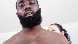 Raven Lane kneels eagerly before Ace Bigs commanding presence offering her devoted rimjob submission.