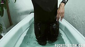 she slips into tight neoprene for extreme underwater lung hold