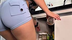 imagine peeling those tight shorts off her very sexy latina big ass in the kitchen
