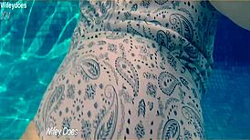 Wife flashes hot one-piece swimsuit at hotel pool