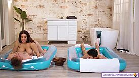 BUSTY MILF MASSEUSE Deepthroats TWO VIRGIN COCKS In Nuru Oil