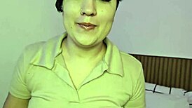 latina brunette strips lingerie on bed fingering her shaved pussy close-up