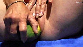 Wet pussy gapes wide on thick cucumber close-up masturbation play