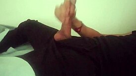 Horny guy jerks massive cock in black pants post-work