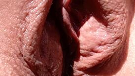 Mature Cougar Boldly Suns Shaved Vulva in Thong