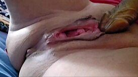 amateur greek wife rams huge dildos deep in shaved pussy for squirting orgasm closeup