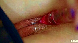 Isn't this young Latina's wet shaved pussy the pinkest toy-stuffed orgasm ever?!