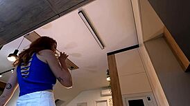 Hey check out this redhead hot wife modeling her new white miniskirt and pink panties before stripping