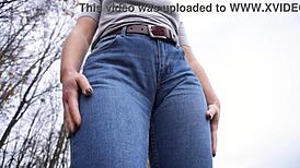 Milf flaunts massive cameltoe pussy lips through tight blue jeans outdoors