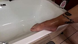 Sexy Oiled Slut Fingers Pussy While Rubbing Oil Over Massive Tits and Curves