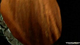 Busty redhead craving cock heads straight to gloryhole for massive load!