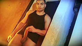 Why's this muscular bodybuilder's big cock so hard to lift against the wall?