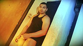 Why's this muscular bodybuilder's big cock so hard to lift against the wall?