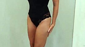 Black bodysuit clings tight over black heels in steamy try-on