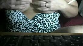 A naughty mature wife teases her shaved pussy online for strangers' eyes only