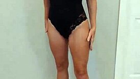 Black bodysuit clings tight over black heels in steamy try-on