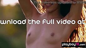 petite filipina kit rysha strips nude posing sexy in wildflower field outdoors