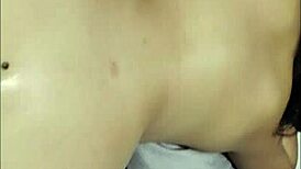 She plays with her new toy anally for the first time in bedroom.