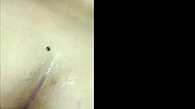 She plays with her new toy anally for the first time in bedroom.