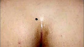 She plays with her new toy anally for the first time in bedroom.